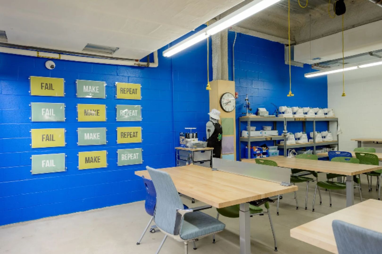 image of empty makery studio with table and chairs, vibrant painted walls